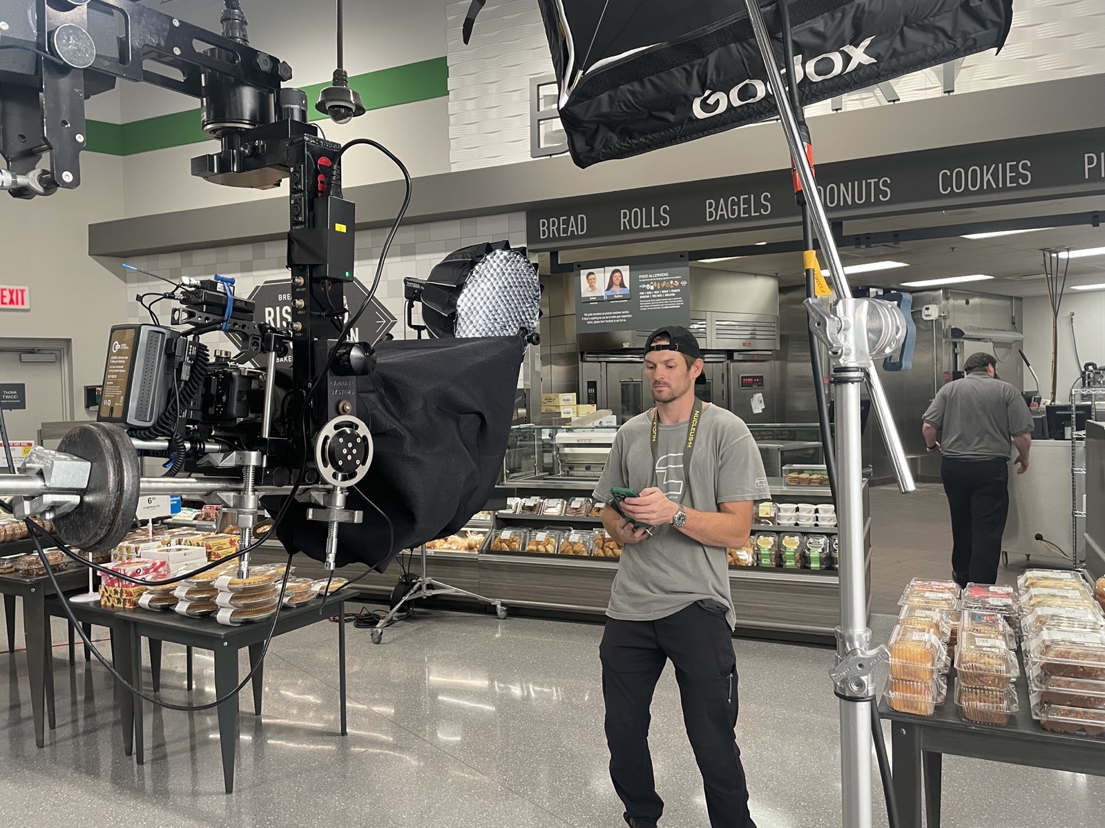 In-store commercial shoot with camera crane and teleprompter